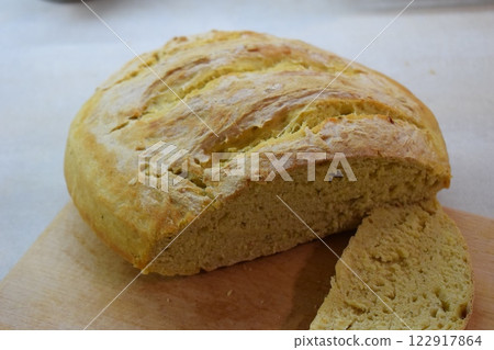 Soft and Airy Homemade Bread on Cutting Board 122917864