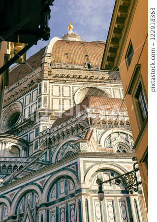 Cathedral Santa Maria del Fiore in Tuscany, Florence, Italy. Concept of travel, tourism and vacation in city. Architecture and landmark of Florence. 122918363