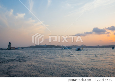 Beautiful sunset over Bosphorus with famous Maidens Tower also known as Leanders Tower, symbol of Istanbul, Turkey Beautiful sunset over Bosphorus with famous Maidens Tower also known as Leanders Tower, symbol of Istanbul, Turkey 122918679