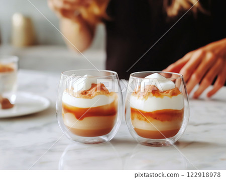 Two elegant coffee desserts with rich caramel layers Two elegant coffee desserts with rich caramel layers 122918978