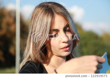 Woman Reading A Surprising News On A Letter  122919573