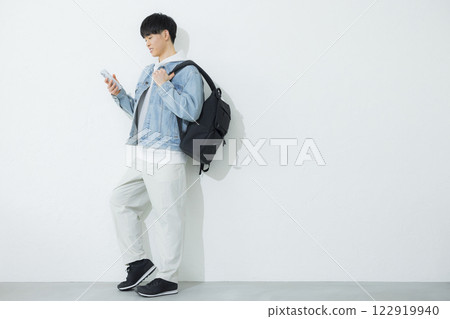 A man operating a smartphone A man operating a smartphone 122919940