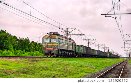 Soviet-built electric locomotive hauling a freight train near Siversk, currently an active war zone in Russo-Ukrainian War in Donetsk region of Ukraine 122920252
