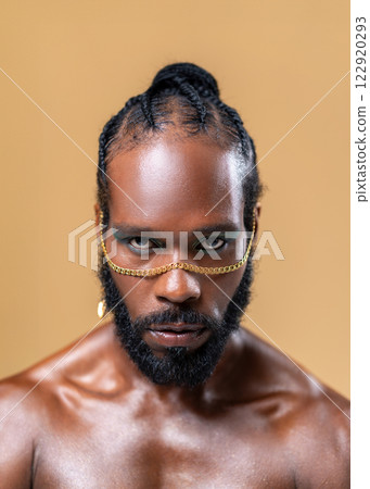 Serious African American shirtless gay model with 122920293