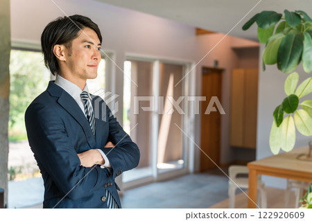 Young male Asian businessman wearing a suit, jacket, suit (tie, style) 122920609