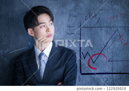 Image of a young businessman in his twenties wearing a suit and advertising and marketing Image of a young businessman in his twenties wearing a suit and advertising and marketing 122920828