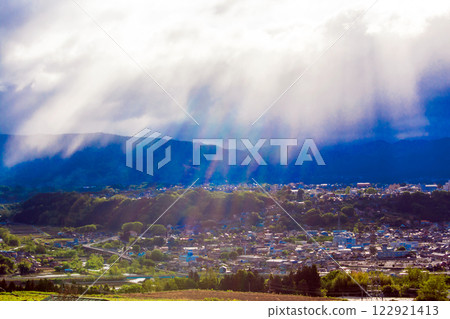 A castle town bathed in light 122921413