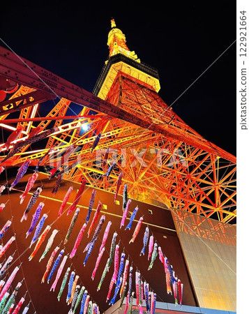 Tokyo Tower illuminated at night with carp streamers flying Tokyo Tower illuminated at night with carp streamers flying 122921664