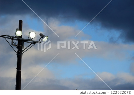 The lights were turned on because it was dark and covered by thick clouds. 122922078