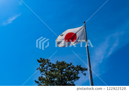 The Japanese flag hoisted at Izumo Taisha Shrine The Japanese flag hoisted at Izumo Taisha Shrine 122922520
