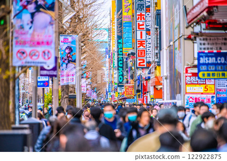 Tokyo cityscape, Japan. February. Akihabara is crowded with foreign tourists. Japanese people are dressed in masturbation costumes again... = 5th 122922875