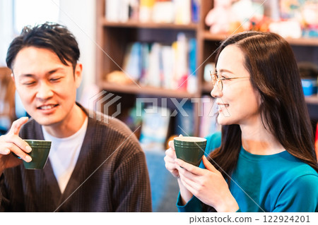 Young couple talking over coffee Young couple talking over coffee 122924201