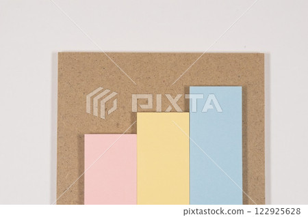 Pastel colored sticky notes and MDF Pastel colored sticky notes and MDF 122925628