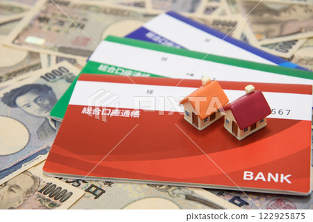 Money, bankbook and house Money, bankbook and house 122925875