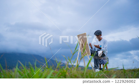 Outdoor Painting, Young Artist Capturing Mountain Views on Canvas under Cloudy Skies 122926002