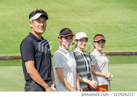 Golfer men and women playing golf on the golf course 122926223