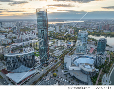 Yekaterinburg city with Buildings of Regional Government and Parliament, Dramatic Theatre, Iset Tower, Yeltsin Center, panoramic view at summer sunset. Yekaterinburg city with Buildings of Regional Government and Parliament, Dramatic Theatre, Iset Tower, Yeltsin Center, panoramic view at summer sunset. 122926413