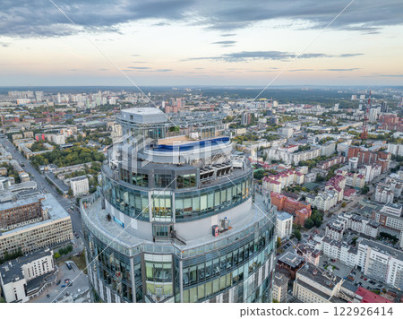 Aerial view of the Yekaterinburg city center with Vysotsky skyscraper. Beautiful landscape of a high-rise building with a rooftop pool and glass facade in Russia Aerial view of the Yekaterinburg city center with Vysotsky skyscraper. Beautiful landscape of a high-rise building with a rooftop pool and glass facade in Russia 122926414