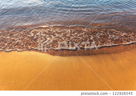 Soft wave of the sea on the sandy beach. Soft wave of the sea on the sandy beach. 122926545