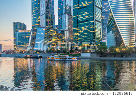 Cruise ship sails on the Moscow river in Moscow city center, popular place for walking. Cruise ship sails on the Moscow river in Moscow city center, popular place for walking. 122926612