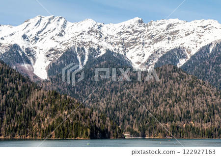 Scenic lake and high snow capped mountains in the background 122927163