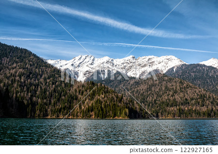 Picturesque lake and high snow capped mountains in the background Picturesque lake and high snow capped mountains in the background 122927165