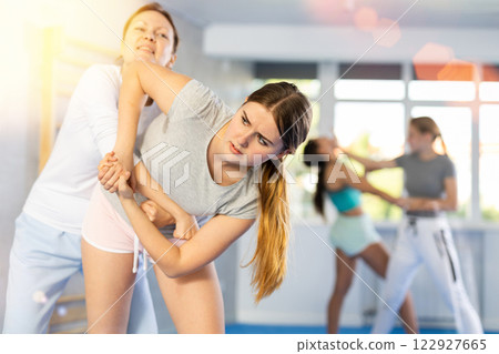 Females practicing self defence moves Females practicing self defence moves 122927665