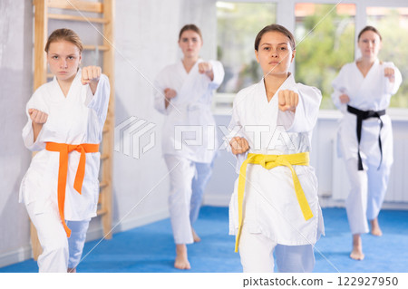 Teenage girls in kimono doing kata training 122927950