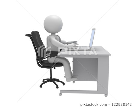 A businessman at a desk operating a laptop 122928142