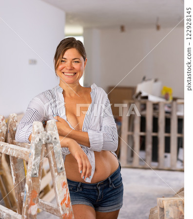 Sexy woman posing in building site Sexy woman posing in building site 122928145