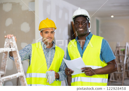 Portrait of two professional builders doing finishing work at cottage 122928458