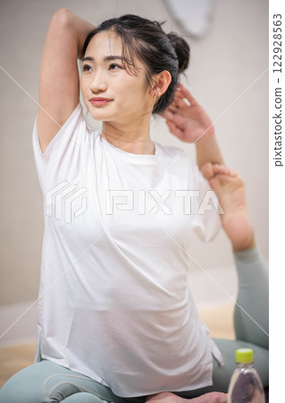 Young woman practicing yoga indoors Young woman practicing yoga indoors 122928563
