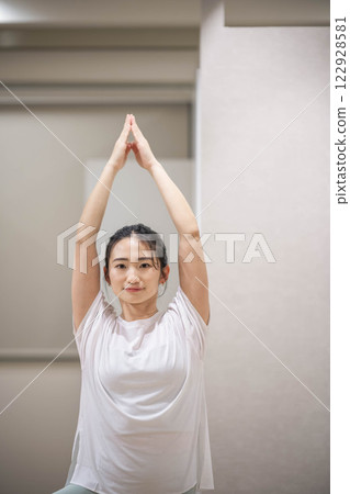 Young woman practicing yoga indoors 122928581