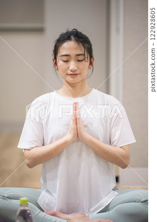 Young woman practicing yoga indoors 122928605