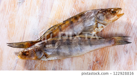 Jerked pikeperch on a wooden table 122928816