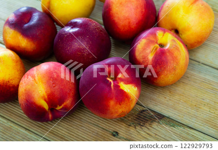 Fresh nectarine on wooden background, fruit vegan food 122929793