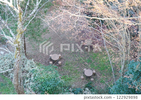Table and chairs in the forest 122929898