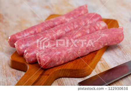 Raw pork sausages for grilling 122930638