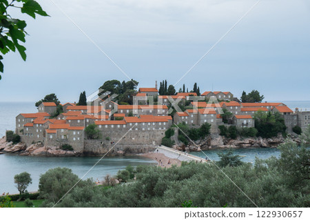 Sveti Stefan private island in Montenegro near Budva. Adriatic Sea Coast travel destination vacation holiday idea. Concept of getting away tourism experiences. Nature driven scenery Sveti Stefan private island in Montenegro near Budva. Adriatic Sea Coast travel destination vacation holiday idea. Concept of getting away tourism experiences. Nature driven scenery 122930657