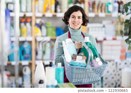Middle-aged woman choosing laundry detergent at supermarket Middle-aged woman choosing laundry detergent at supermarket 122930665