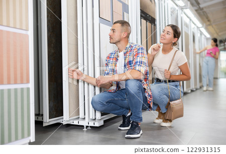 Construction store - married couple chooses ceramic flooring Construction store - married couple chooses ceramic flooring 122931315