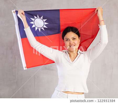 Portrait of positive young woman with flag of Taiwan Portrait of positive young woman with flag of Taiwan 122931384