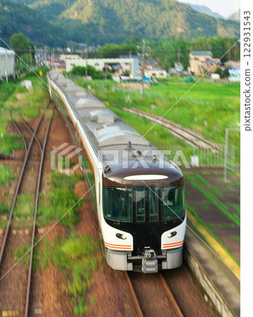 Limited Express Hida train running at Shimoaso Station on the JR Takayama Main Line Limited Express Hida train running at Shimoaso Station on the JR Takayama Main Line 122931543