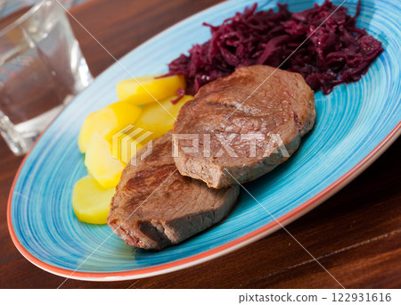 Veal steak with potato and sauerkraut Veal steak with potato and sauerkraut 122931616