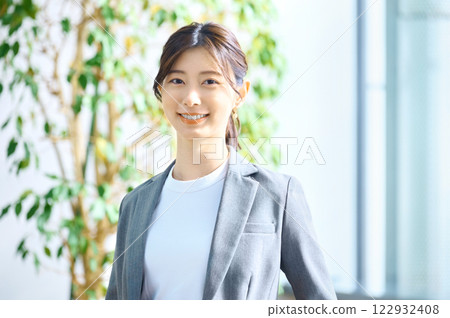 Young businesswoman working in an office. Photo courtesy of Sky Perfect TV Tokyo Media Center. Young businesswoman working in an office. Photo courtesy of Sky Perfect TV Tokyo Media Center. 122932408