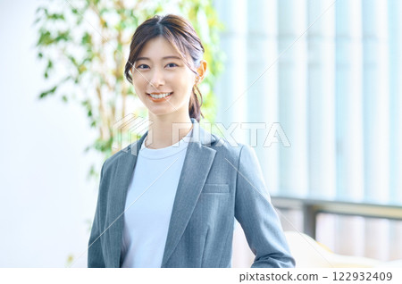 Young businesswoman working in an office. Photo courtesy of Sky Perfect TV Tokyo Media Center. Young businesswoman working in an office. Photo courtesy of Sky Perfect TV Tokyo Media Center. 122932409