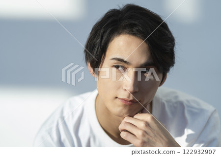 A man in his 20s looking at the camera Men's beauty Skin care image A man in his 20s looking at the camera Men's beauty Skin care image 122932907