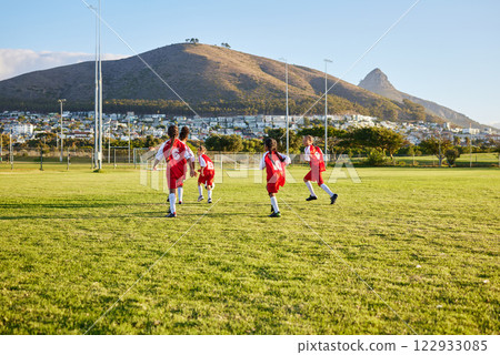 Girls, soccer team or fitness game on grass field in workout, training or exercise for game or match goals. Running, football or sports children, students or kids in energy competition at high school Girls, soccer team or fitness game on grass field in workout, training or exercise for game or match goals. Running, football or sports children, students or kids in energy competition at high school 122933085