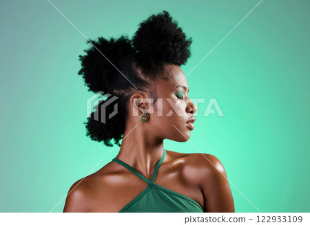 Black woman, green makeup and face on skin for beauty, fashion and cosmetics against backdrop. Model, girl and hair, show afro, eyeshadow and lips in portrait with studio background in New Orleans 122933109