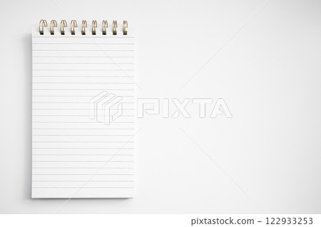 Blank notepad with lined pages on white background Blank notepad with lined pages on white background 122933253